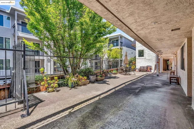 a view of a house with sitting area and potted plants