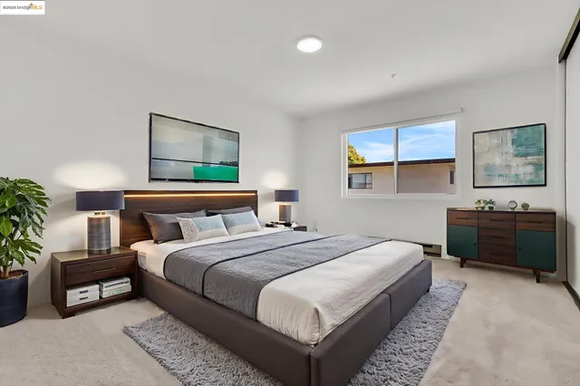 a bedroom with a bed and a couch