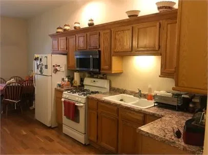 a kitchen with a stove and a refrigerator