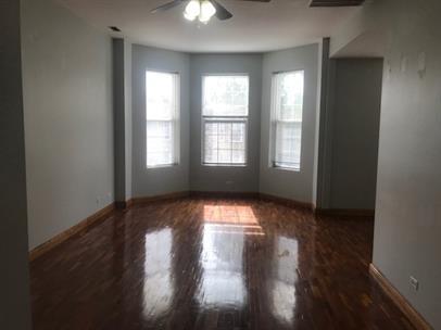4219 South Union Avenue, Unit 2 Chicago, IL 60609 - Photo 10 of 25 a view of empty room with wooden floor and fan