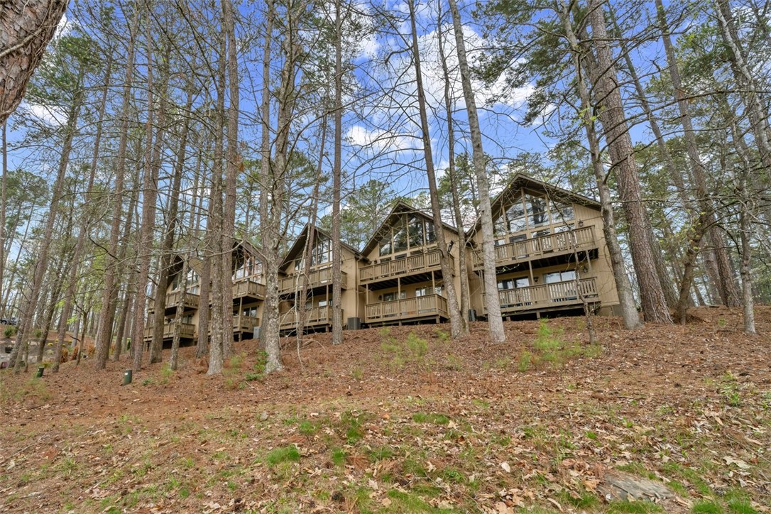 560 South Flagship Drive, Unit 6 Salem, SC 29676 - Photo 14 of 14 This forest retreat features multiple levels and expansive windows, blending seamlessly with the natural surroundings.