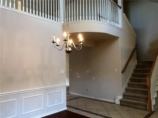 a view of staircase with white walls