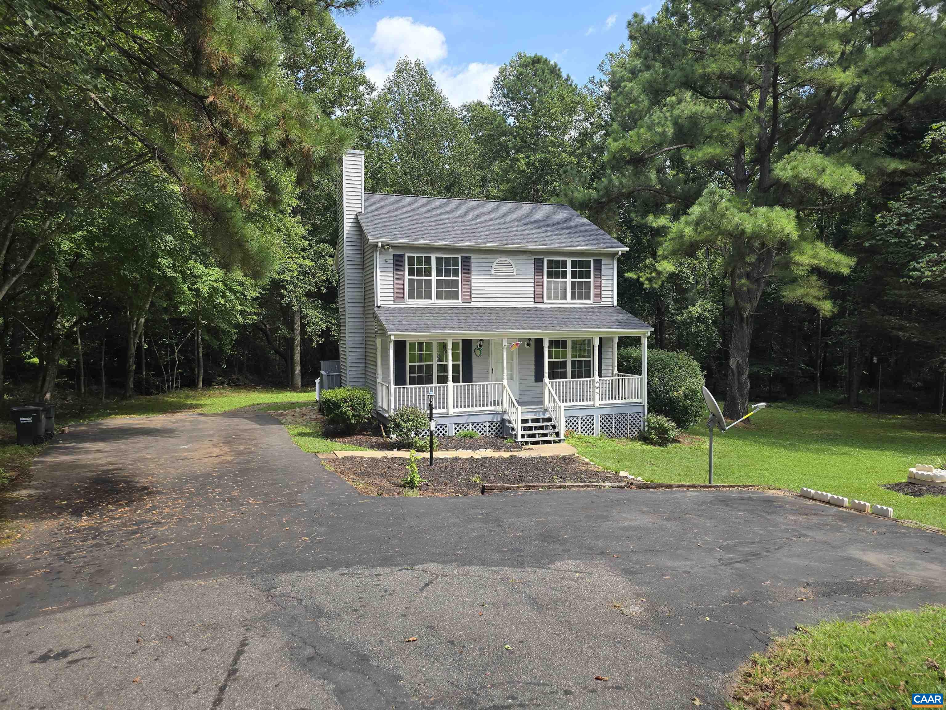 259 Spring Oaks Lane Ruckersville, VA 22968 - Photo 2 of 30 a front view of a house with a yard