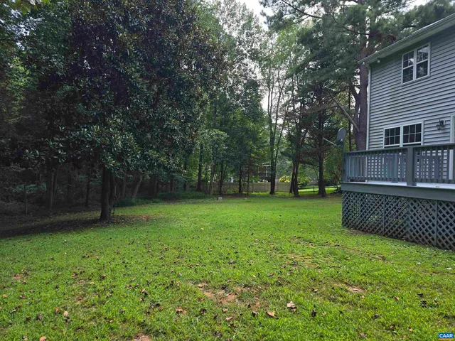 a view of a backyard with a small cabin