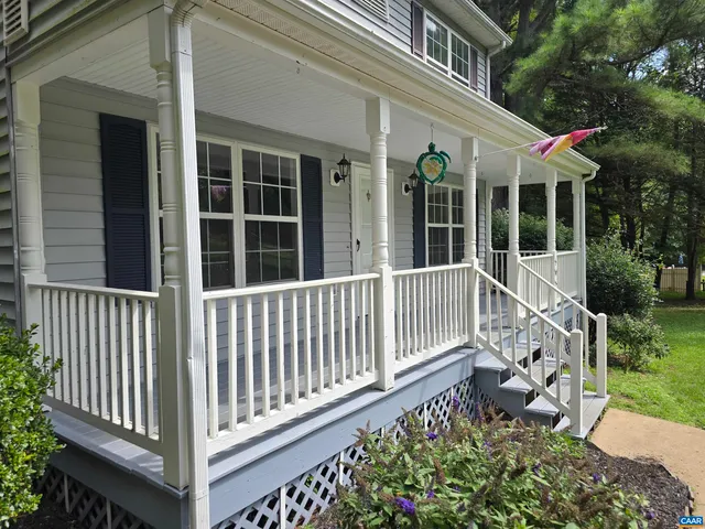 a view of a chair and table in the patio