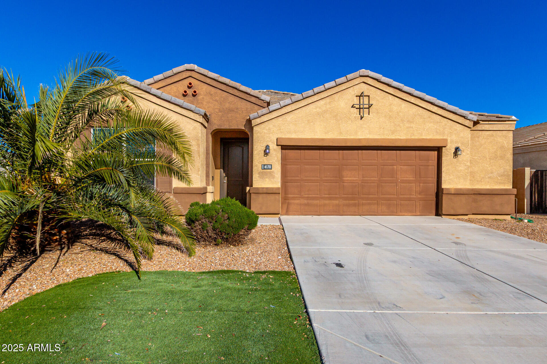4170 West South Butte Road San Tan Valley, AZ 85144 - Photo 1 of 47 a front view of a house with a yard