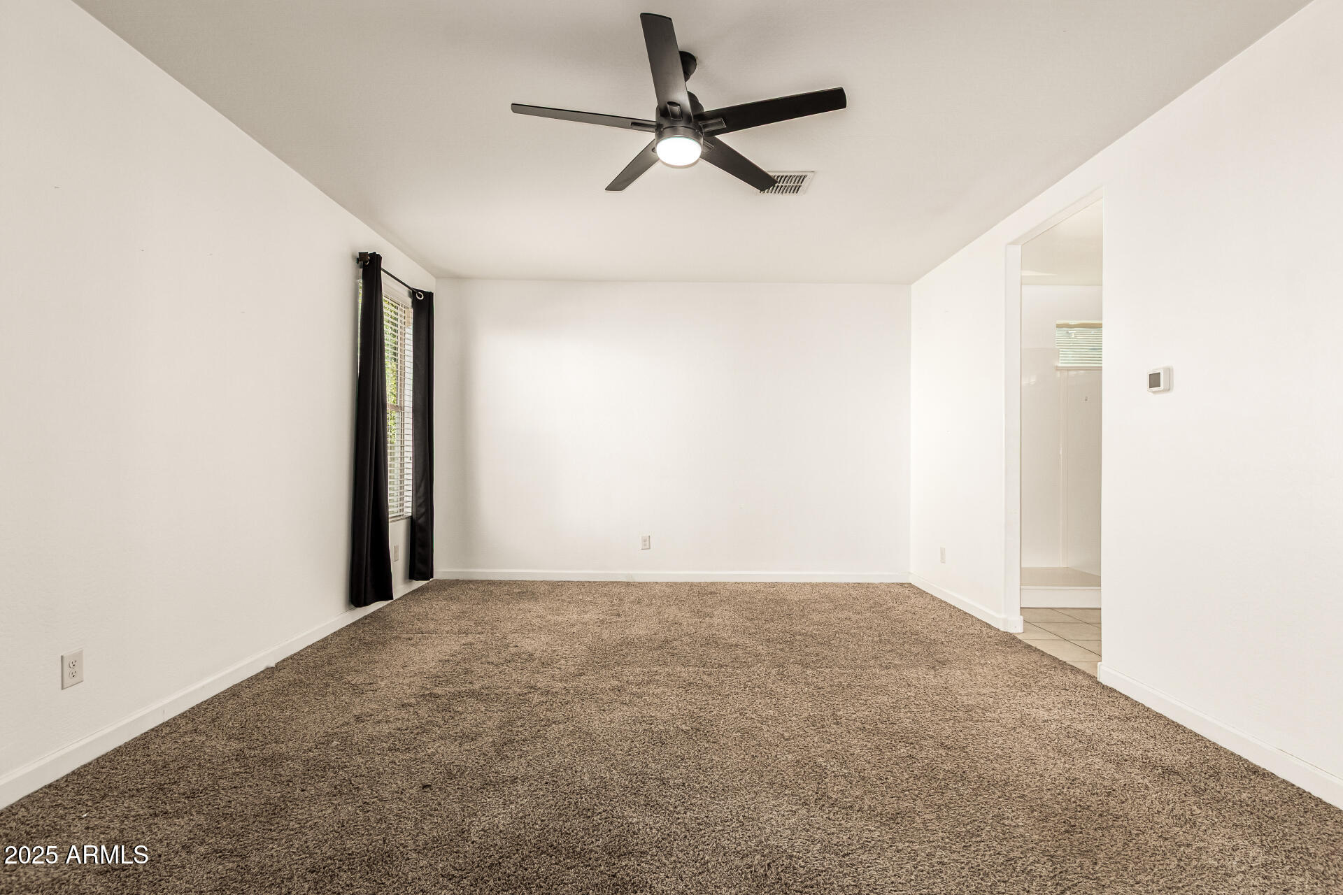 4170 West South Butte Road San Tan Valley, AZ 85144 - Photo 17 of 47 a view of a room with a ceiling fan