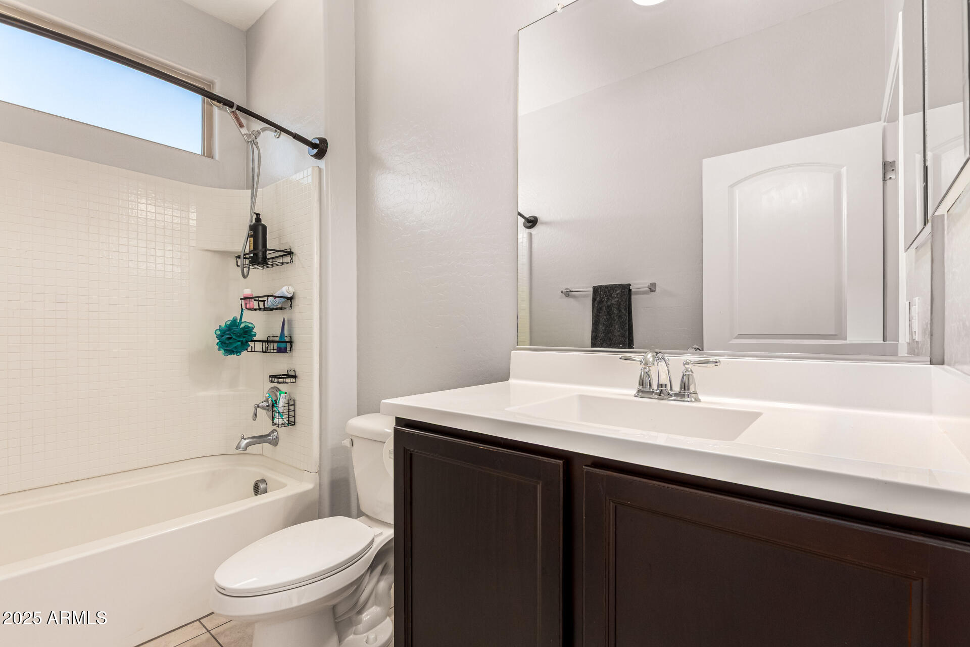 4170 West South Butte Road San Tan Valley, AZ 85144 - Photo 23 of 47 a bathroom with a granite countertop sink toilet a mirror a bathtub and shower
