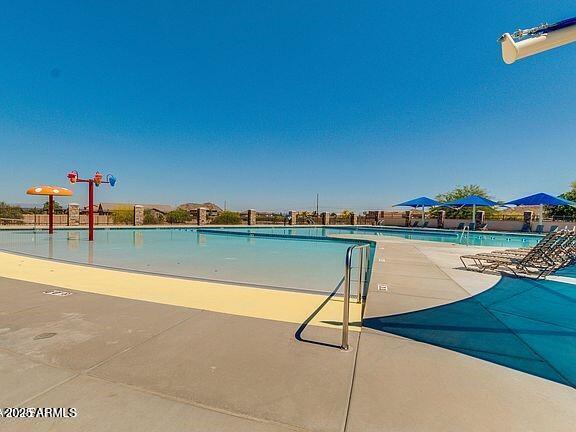 4170 West South Butte Road San Tan Valley, AZ 85144 - Photo 46 of 47 a view of a swimming pool and an outdoor space