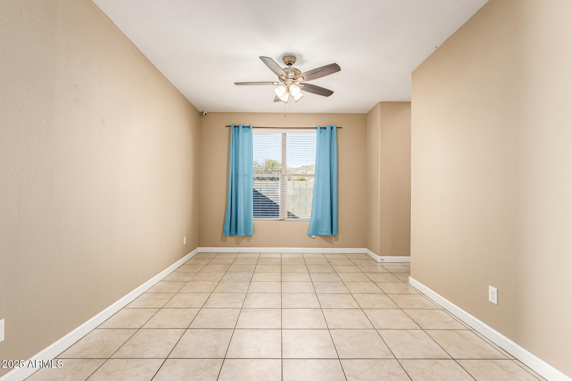 4170 West South Butte Road San Tan Valley, AZ 85144 - Photo 5 of 47 a view of an empty room with a window