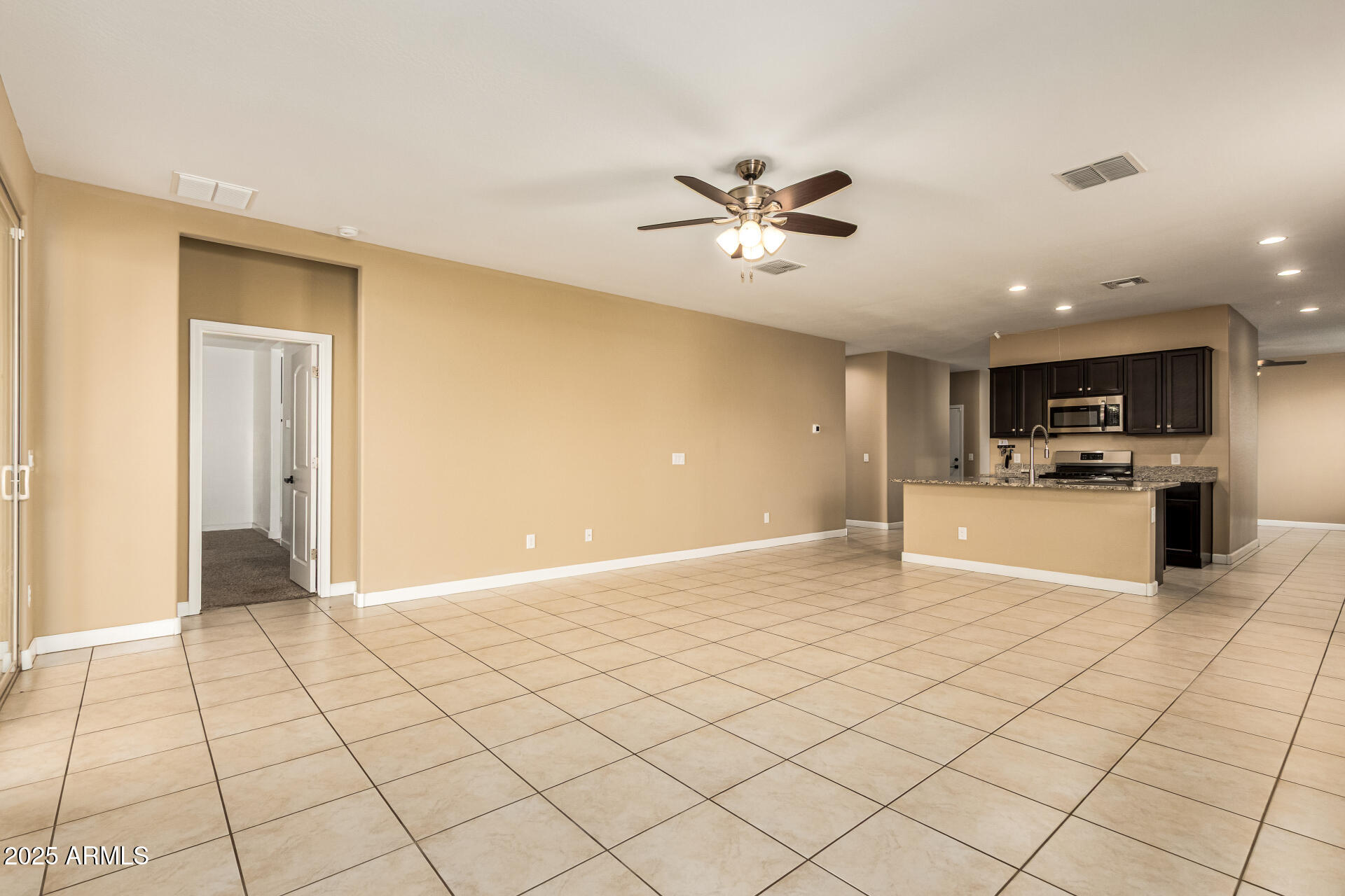 4170 West South Butte Road San Tan Valley, AZ 85144 - Photo 9 of 47 a view of a kitchen with a sink and cabinets