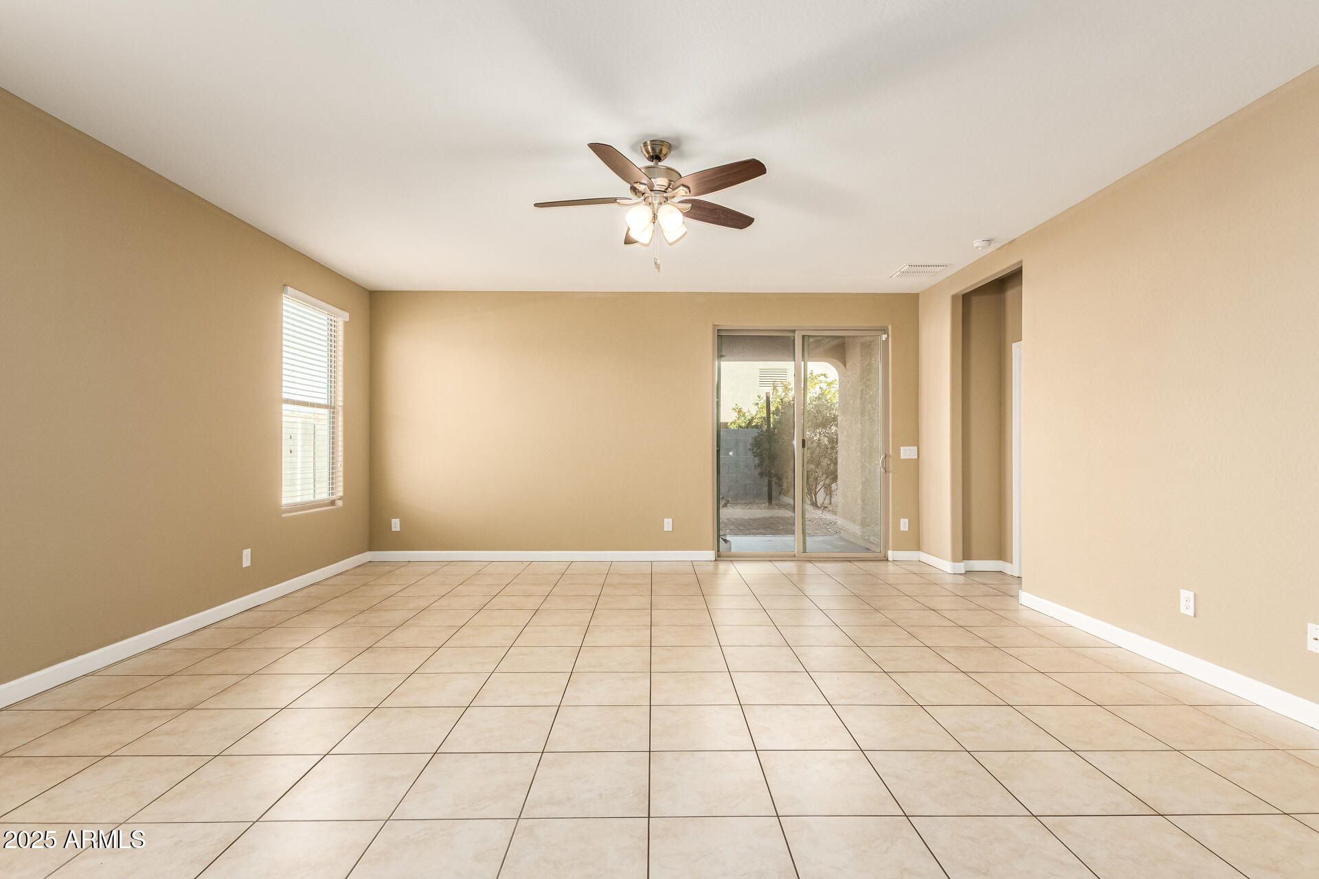 4170 West South Butte Road San Tan Valley, AZ 85144 - Photo 10 of 47 a view of an empty room with a window
