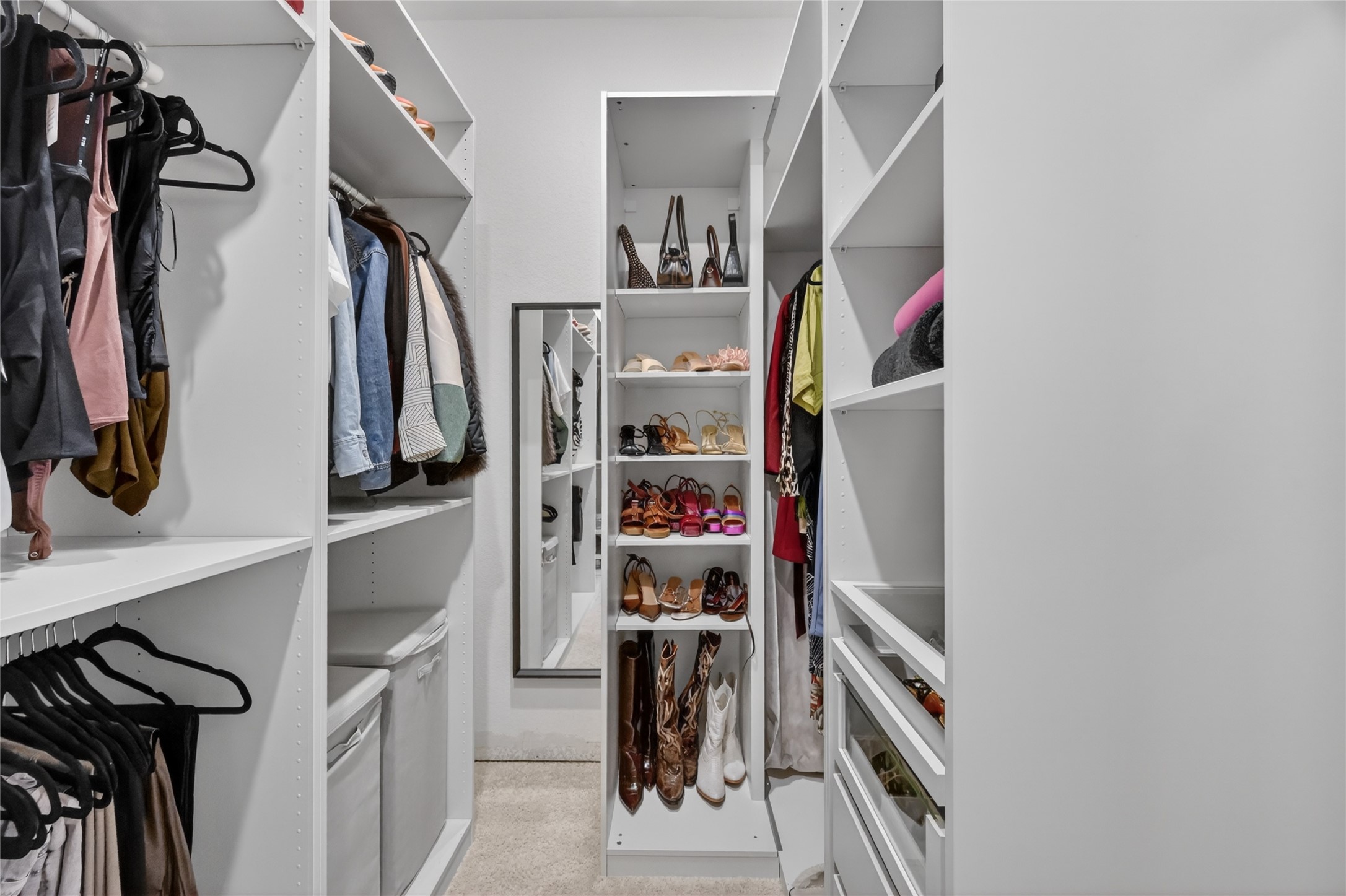 4439 Stone Ridge Lane Manvel, TX 77578 - Photo 27 of 48 a view of walk in closet with clothes and shoes