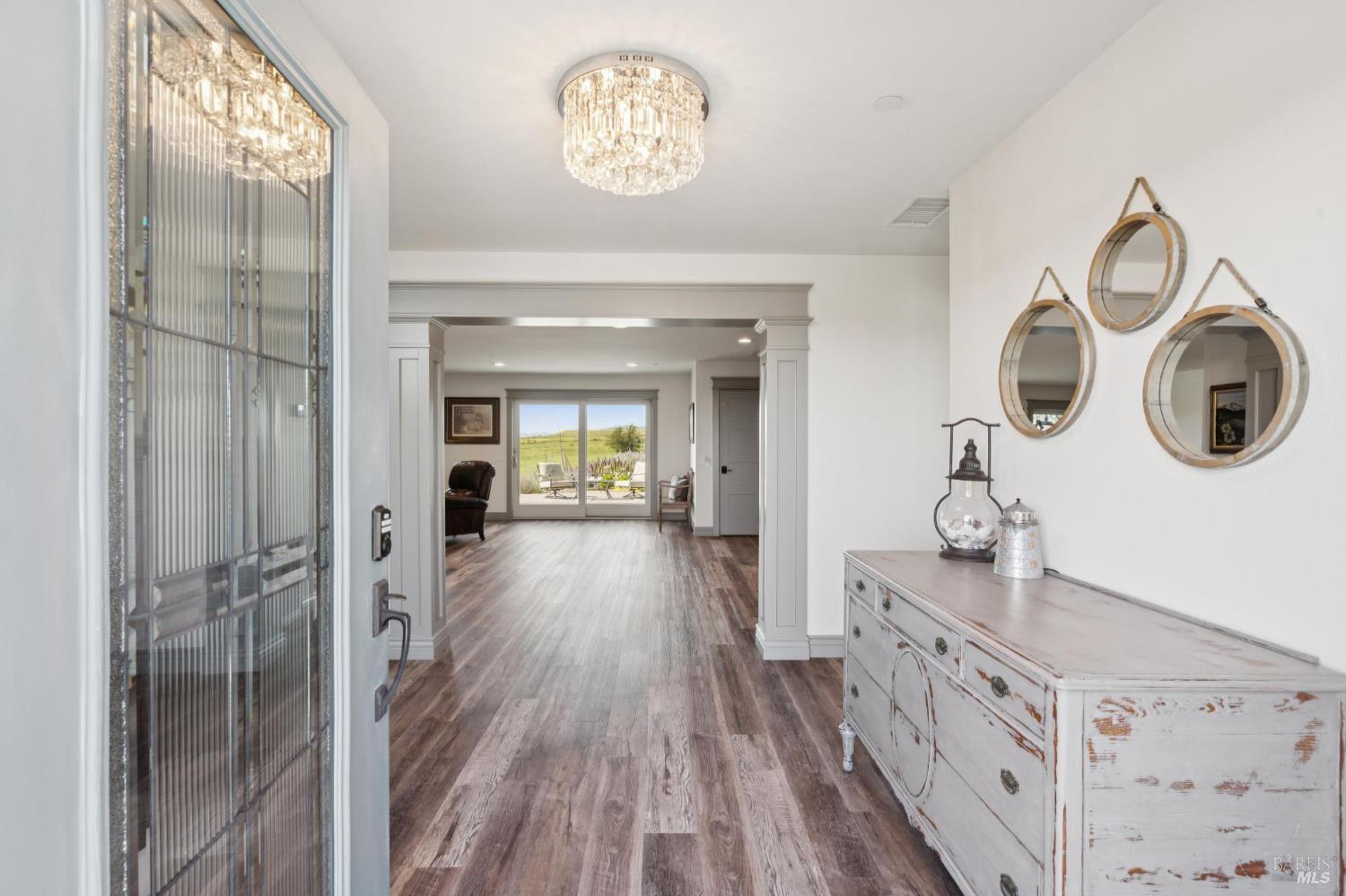 88 Cypress Loop Bodega Bay, CA 94923 - Photo 21 of 88 Greeted with a grand view of beautiful rolling hills and wide plank flooring flowing into the family room and guest bedrooms.