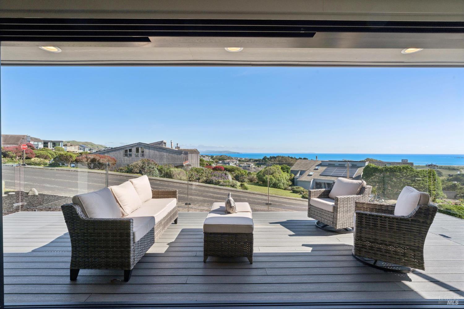 88 Cypress Loop Bodega Bay, CA 94923 - Photo 29 of 88 La Cantina glass doors open wide to provide seamless indoor outdoor flow to the deck off the open great room, kitchen, & dining area. Expansive views of Bodega Harbor, Bodega Bay, Bodega Head and the Pacific beyond gives you endless opportunity to entertain, relax, and enjoy breathtaking sunsets.