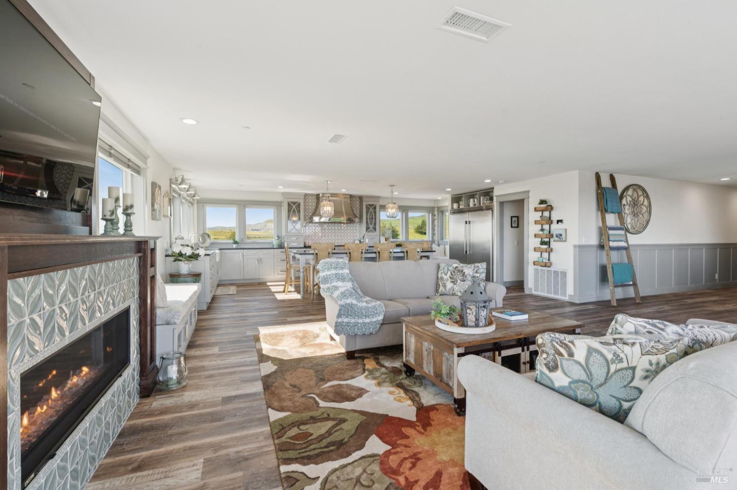 88 Cypress Loop Bodega Bay, CA 94923 - Photo 34 of 88 The great room boasts an abundance of natural light and breathtaking views out every window. Beautiful decorative gas fireplace anchors the living space, flanked by cozy window seats.