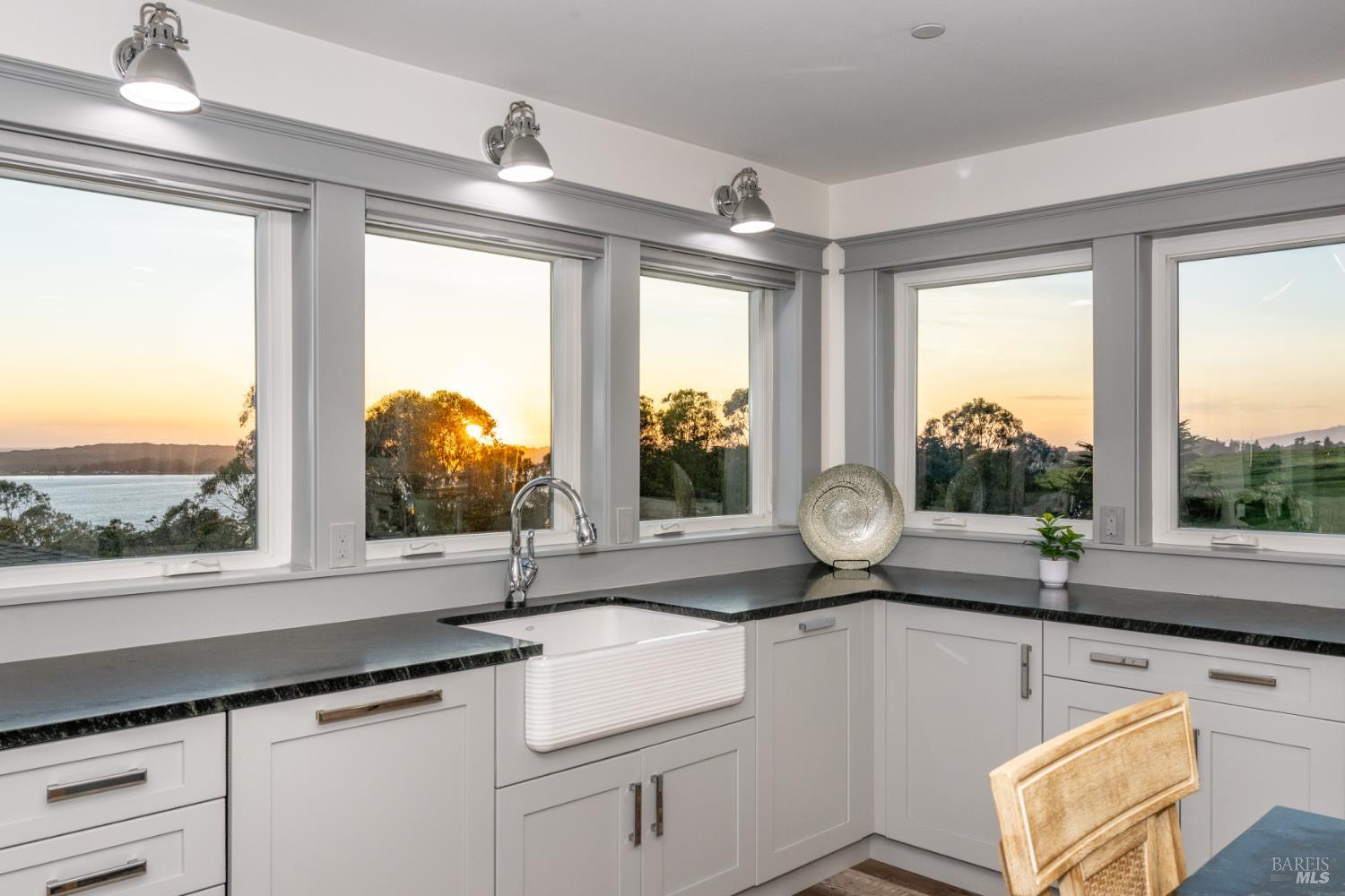 88 Cypress Loop Bodega Bay, CA 94923 - Photo 38 of 88 Picturesque views from each kitchen window overlooking the water & rolling hills behind the home. The kitchen boasts dual sinks, and an abundance of cabinetry and counter space with convenient drawers and pullouts throughout.