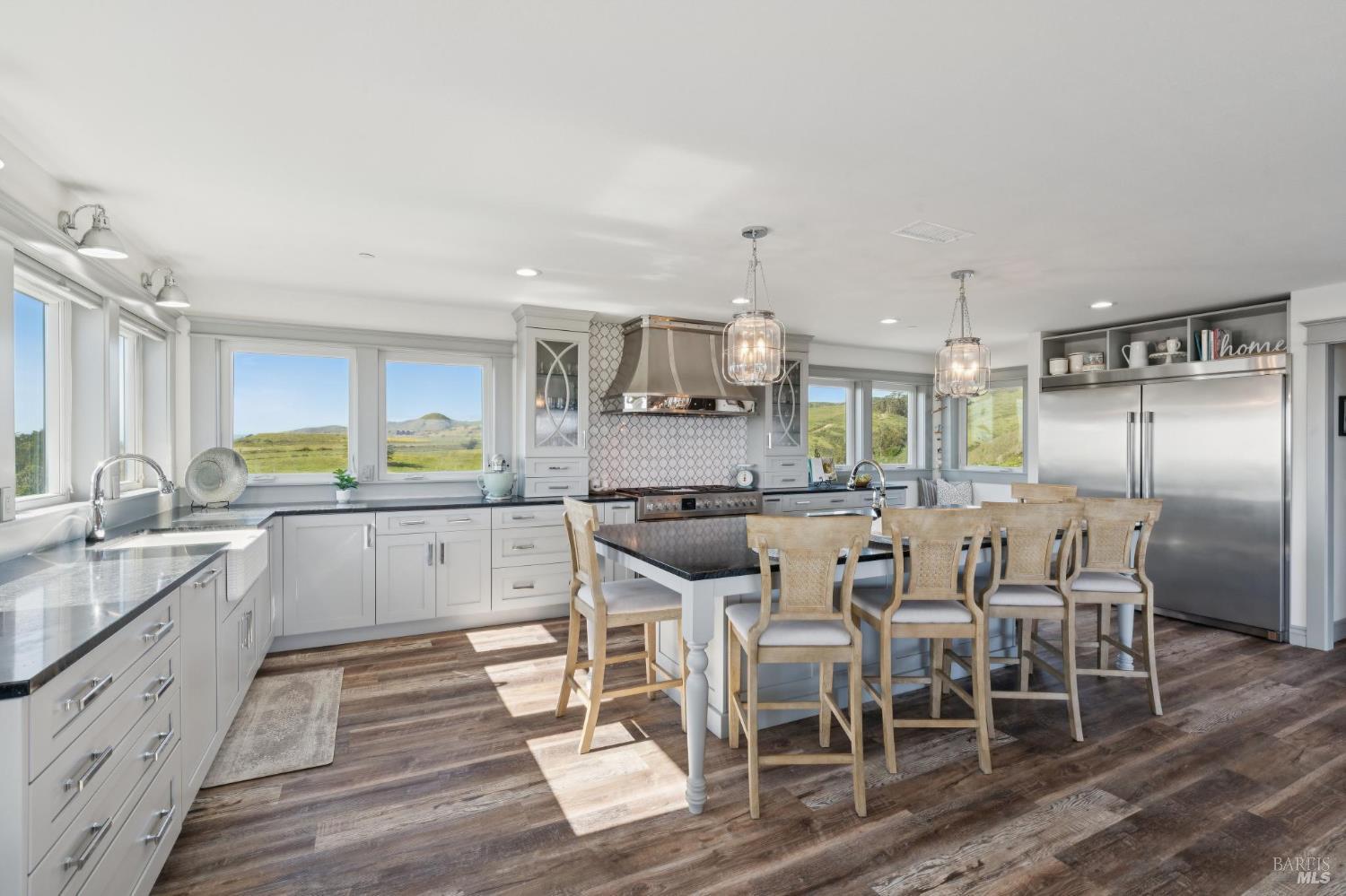 88 Cypress Loop Bodega Bay, CA 94923 - Photo 41 of 88 Spacious chef’s kitchen complete with Electrolux fridge, oversized island, large walk-in pantry, dual ovens, dark soapstone counters, touch-activated faucets, motored window shades and a beautiful backsplash above the Fulgor 6-burner range.