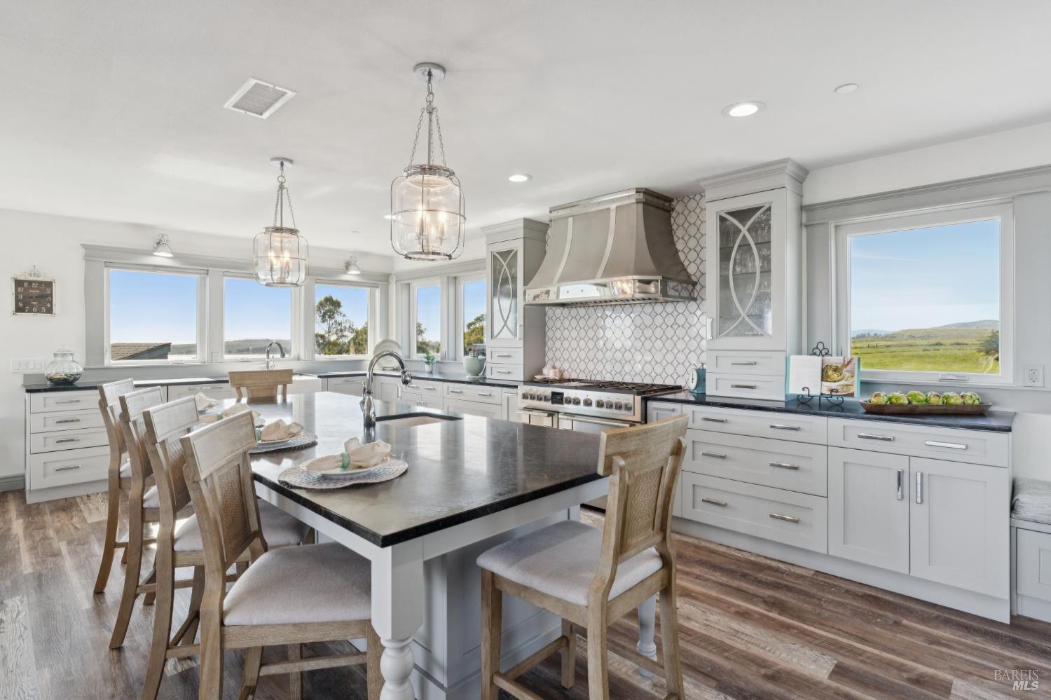 88 Cypress Loop Bodega Bay, CA 94923 - Photo 43 of 88 Spacious chef’s kitchen complete with Electrolux fridge, oversized island, large walk-in pantry, dual ovens, dark soapstone counters, touch-activated faucets, motored window shades and a beautiful backsplash above the Fulgor 6-burner range.