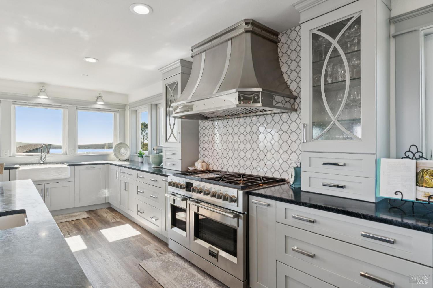 88 Cypress Loop Bodega Bay, CA 94923 - Photo 44 of 88 Spacious chef’s kitchen complete with Electrolux fridge, oversized island, large walk-in pantry, dual ovens, dark soapstone counters, touch-activated faucets, motored window shades and a beautiful backsplash above the Fulgor 6-burner range.