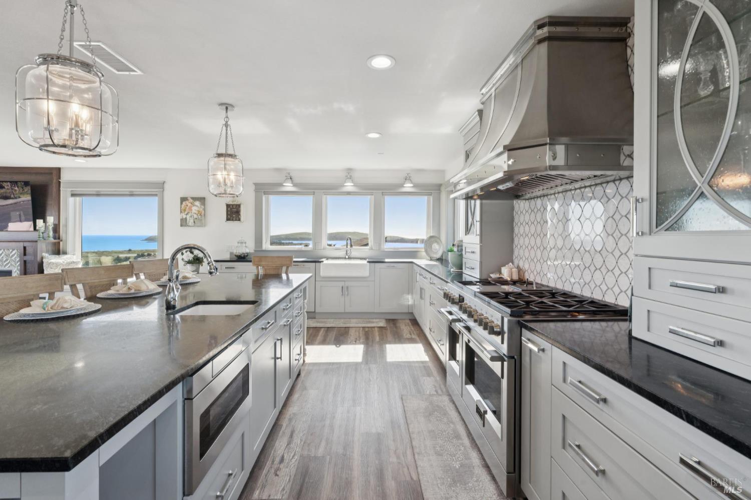 88 Cypress Loop Bodega Bay, CA 94923 - Photo 46 of 88 Spacious chef’s kitchen complete with Electrolux fridge, oversized island, large walk-in pantry, dual ovens, dark soapstone counters, touch-activated faucets, motored window shades and a beautiful backsplash above the Fulgor 6-burner range.