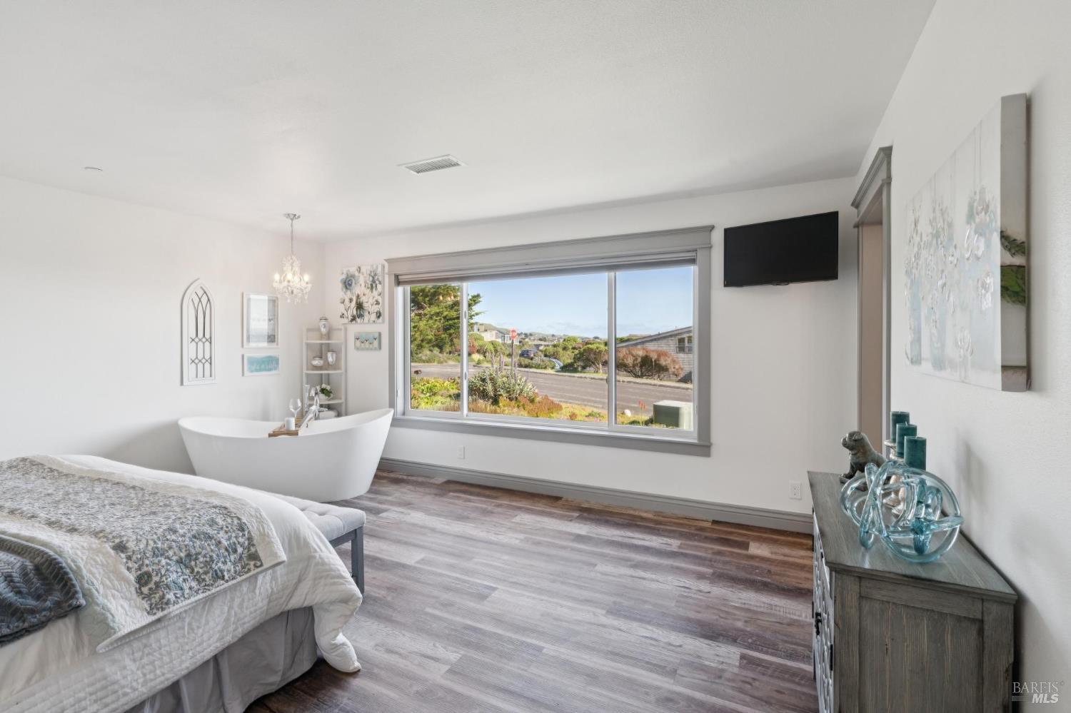 88 Cypress Loop Bodega Bay, CA 94923 - Photo 51 of 88 Take in expansive ocean views from the large primary bedroom and enjoy a glass of wine in your soaking tub with a clear view for watching California sunsets over the ocean.
