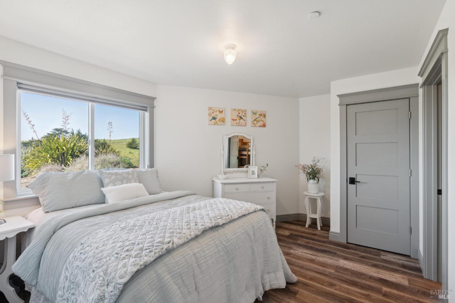 88 Cypress Loop Bodega Bay, CA 94923 - Photo 67 of 88 Lower level guest bedroom with a hillside view, walk-in closet (currently housing a bunk bed for extra sleeping space) and direct access to a full bathroom.