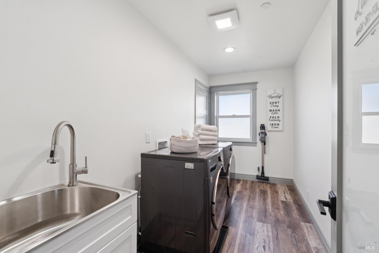88 Cypress Loop Bodega Bay, CA 94923 - Photo 75 of 88 Second level laundry room complete with sink and plenty of storage space with cabinet and closet storage.