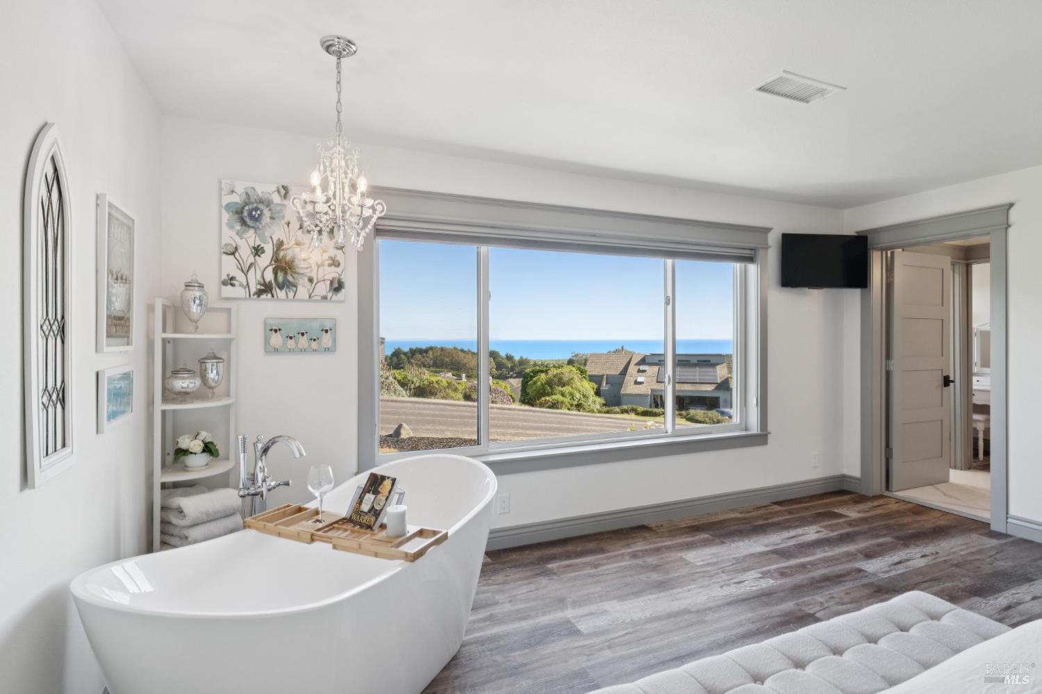 88 Cypress Loop Bodega Bay, CA 94923 - Photo 9 of 88 Take in expansive ocean views from the large primary bedroom and enjoy a glass of wine in your soaking tub with a clear view for watching California sunsets over the ocean.