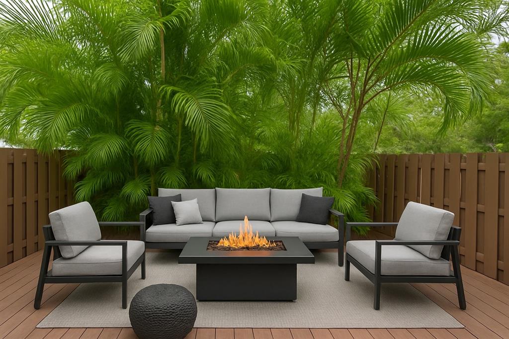 801 Southeast 16th Court, Unit 11 Fort Lauderdale, FL 33316 - Photo 26 of 49 a view of a patio with couches and a dining table and chairs with wooden fence