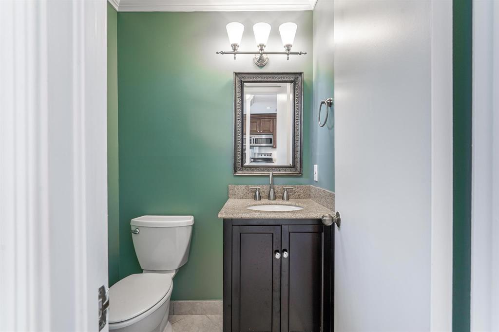 801 Southeast 16th Court, Unit 11 Fort Lauderdale, FL 33316 - Photo 29 of 49 a bathroom with a toilet sink and mirror