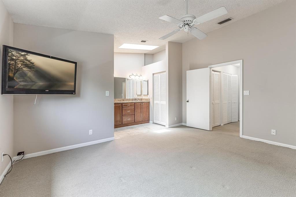 801 Southeast 16th Court, Unit 11 Fort Lauderdale, FL 33316 - Photo 31 of 49 Primary Bedroom w/ Vaulted Ceiling and Skylight