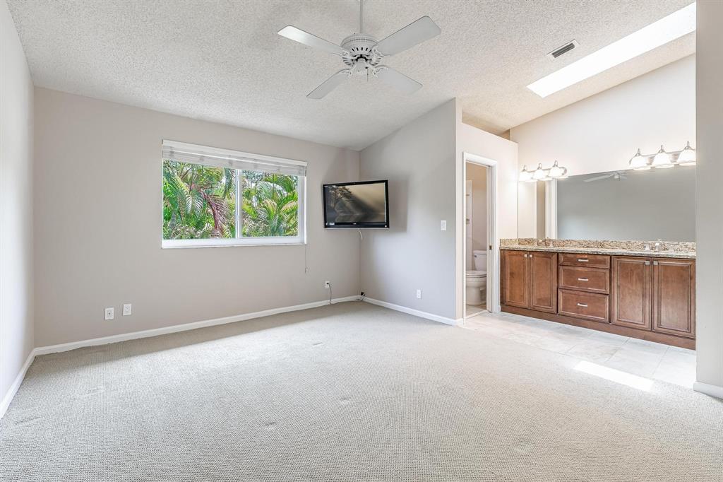 801 Southeast 16th Court, Unit 11 Fort Lauderdale, FL 33316 - Photo 32 of 49 Primary Bedroom w/ Vaulted Ceiling and Skylight