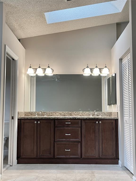 801 Southeast 16th Court, Unit 11 Fort Lauderdale, FL 33316 - Photo 34 of 49 a bathroom with a granite countertop sink and a mirror