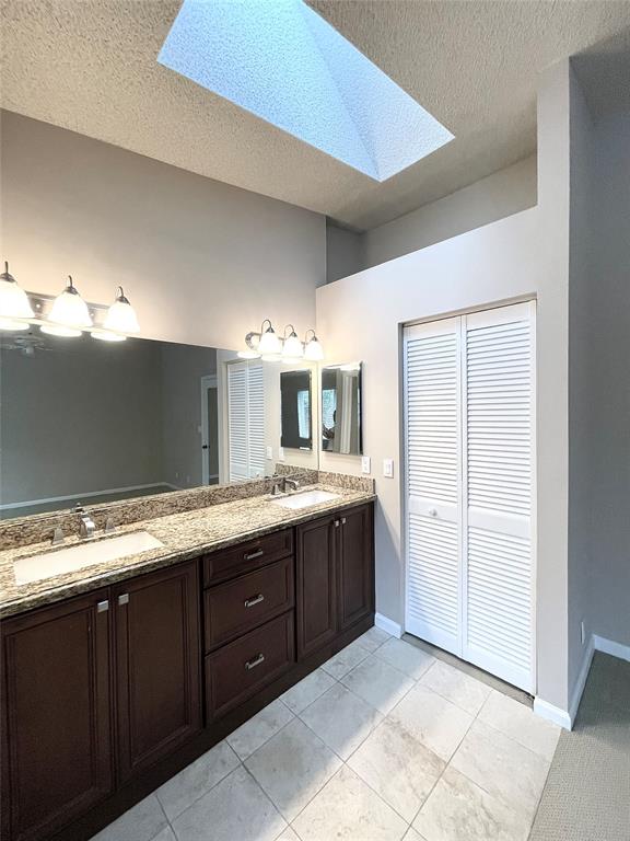 801 Southeast 16th Court, Unit 11 Fort Lauderdale, FL 33316 - Photo 35 of 49 a bathroom with a granite countertop sink and a mirror