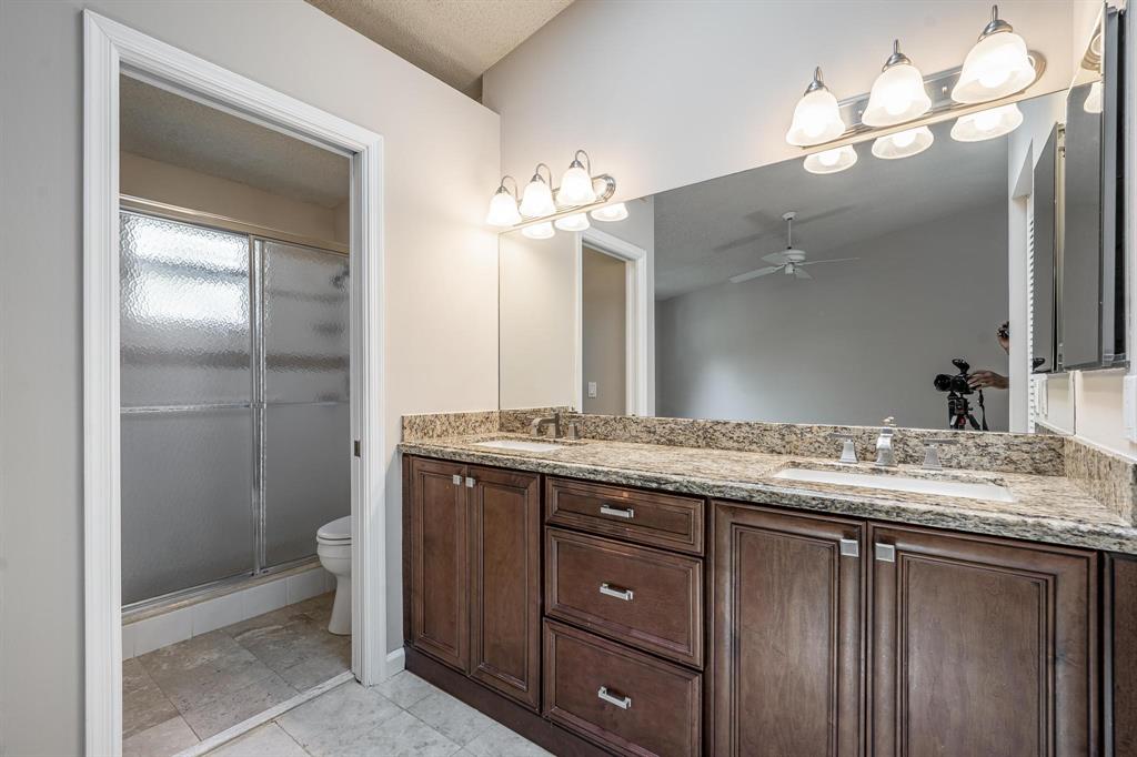 801 Southeast 16th Court, Unit 11 Fort Lauderdale, FL 33316 - Photo 36 of 49 a bathroom with a granite countertop sink and a mirror