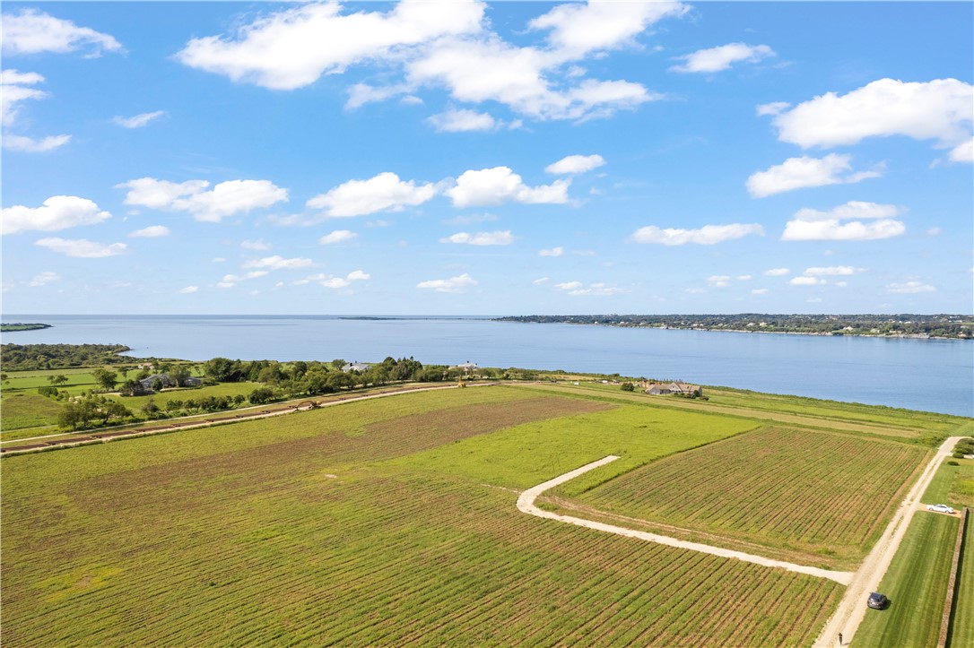 11 Ferolbink Way Little Compton, RI 02837 - Photo 1 of 10 From the Crest of the slope to the Waterfront ---- the perfect spot for your new home!! Views of the river and out to the ocean. The most spectacular sunsets you will ever see.