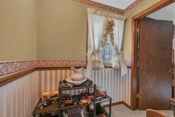 a room with a bed and a mirror