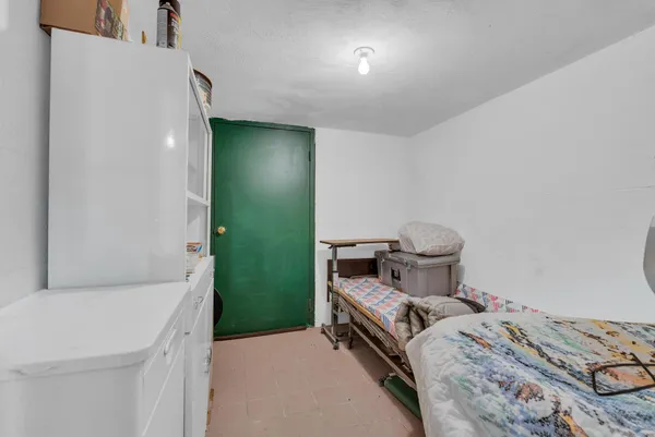 a bed room with a bed and a dresser