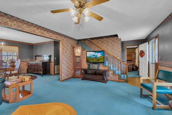 a living room with furniture and a flat screen tv
