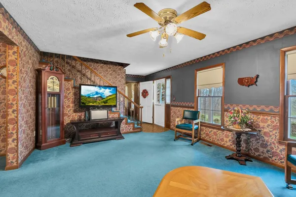 a living room with furniture and a flat screen tv