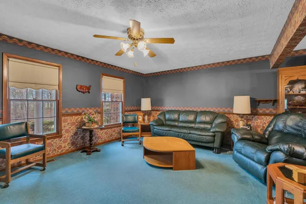 a bedroom with furniture and a chandelier