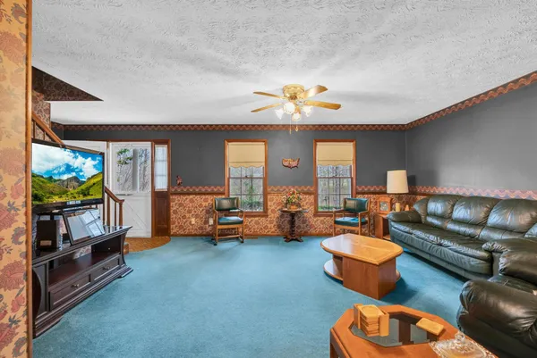 a living room with furniture and a flat screen tv