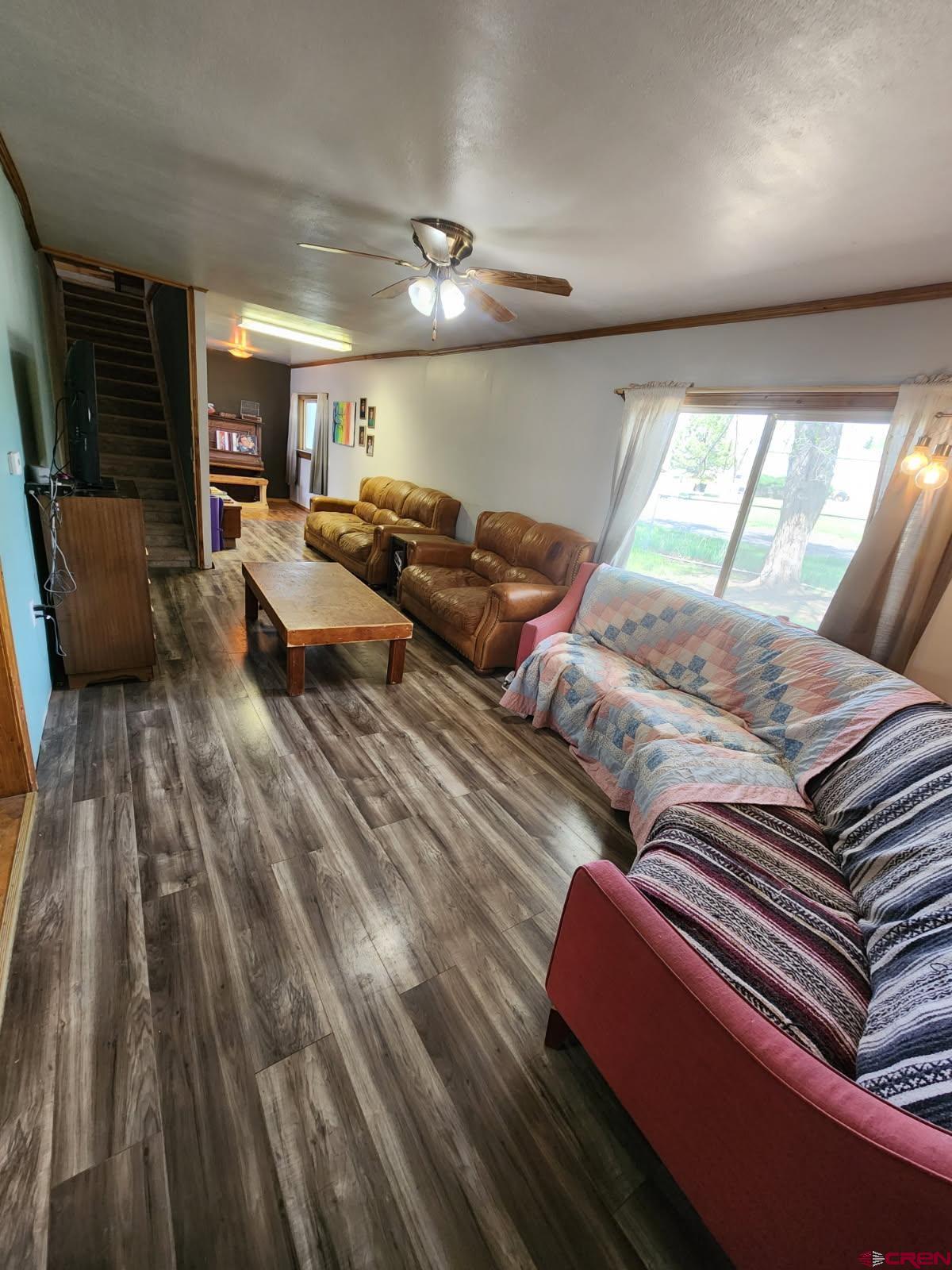 610 Ivy Street Nucla, CO 81424 - Photo 11 of 28 a living room with lots of furniture and wooden floor