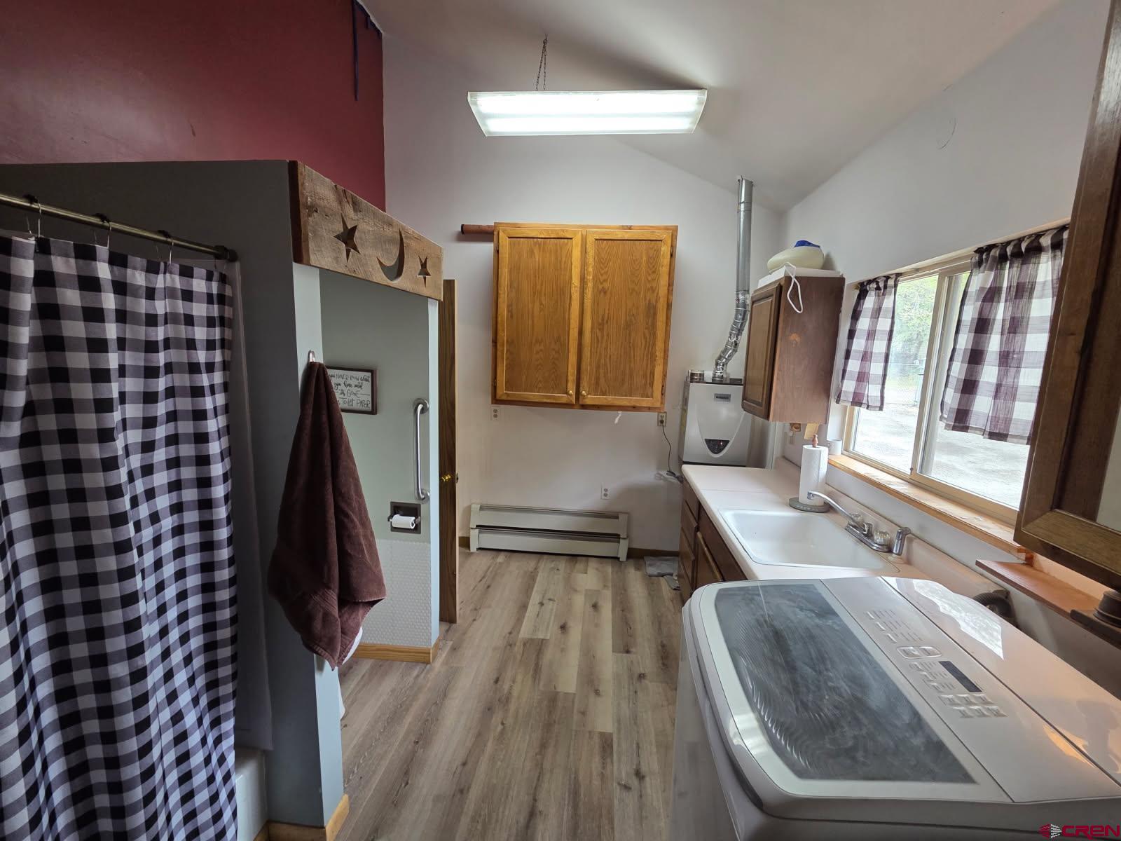 610 Ivy Street Nucla, CO 81424 - Photo 17 of 28 a hallway with a large window and furniture