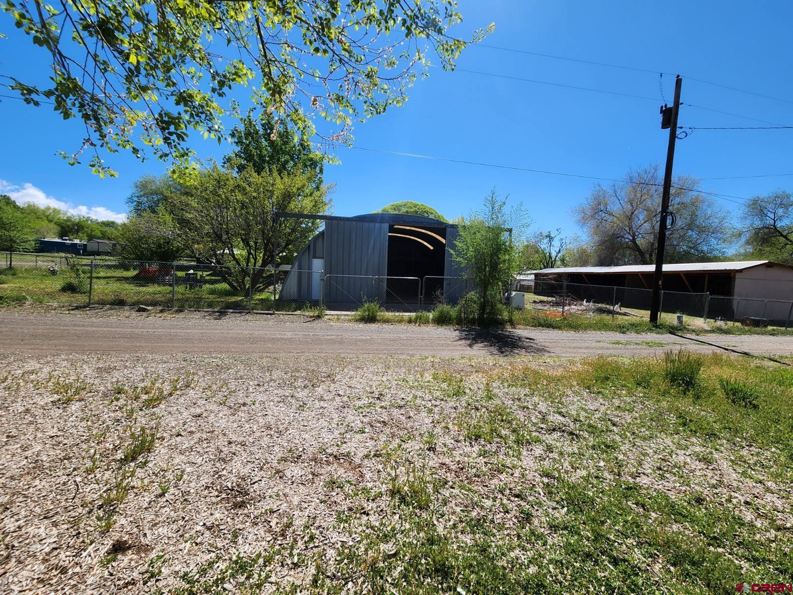 610 Ivy Street Nucla, CO 81424 - Photo 28 of 28 a view of a garden with a bench