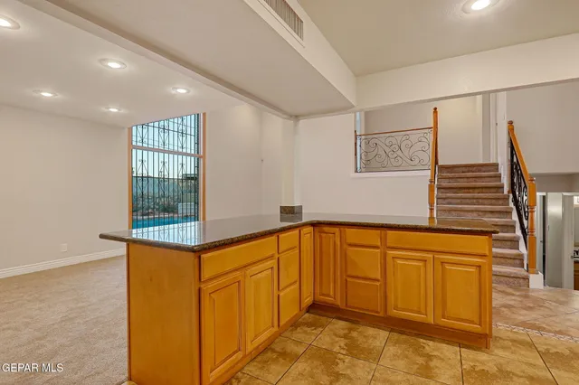a living room with fireplace furniture and a fireplace