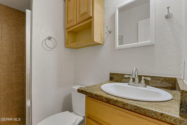 a living room with furniture a rug and a fireplace