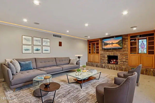 a view of a workspace with furniture and a potted plant
