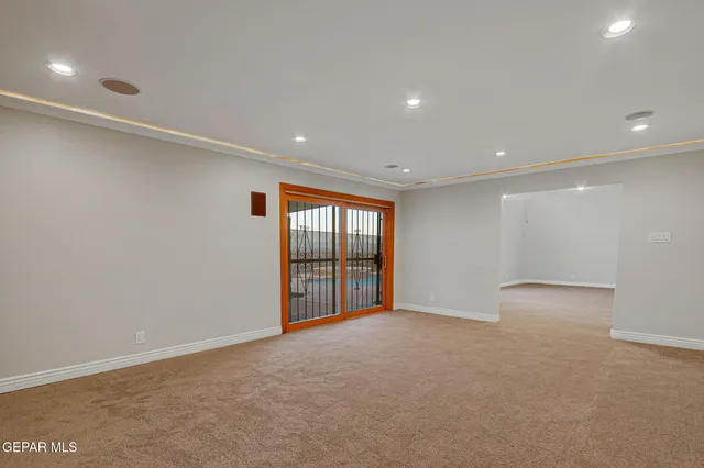 a spacious bedroom with a bed and window